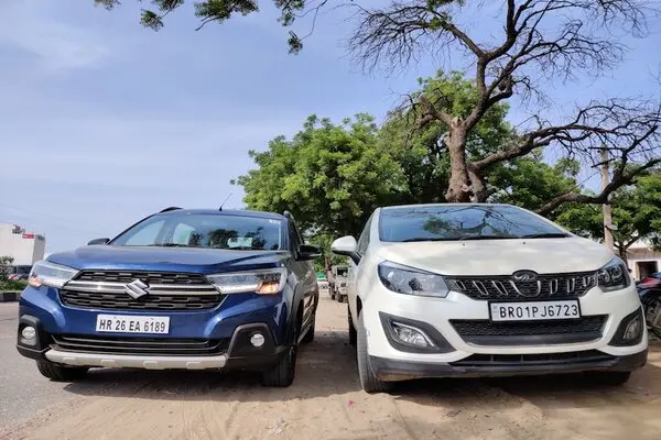 Blue Color Maruti Suzuki XL6 and White Color Mahindra Marazzo Front Profiles